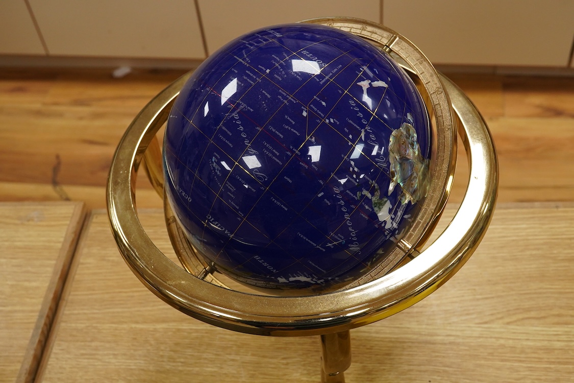 A simulated multi-mineral globe with compass, 30cm in diameter